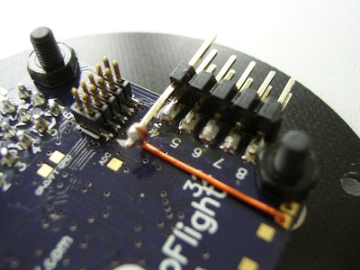 Rev5 board: 3V3 for the Spektrum Sat now comes from the 3V3 supply pin. The wire is an enamelled copper wire (!). the pin is from the second row of a 90° 3-row pinheader.