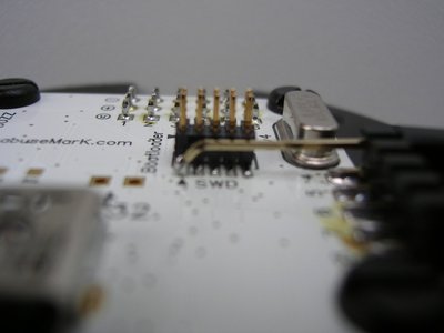 Rev4 board with SWD connector mounted. <br />Side view.